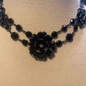 Flowers for mom. A nice statement necklace. Black dark gray hues.